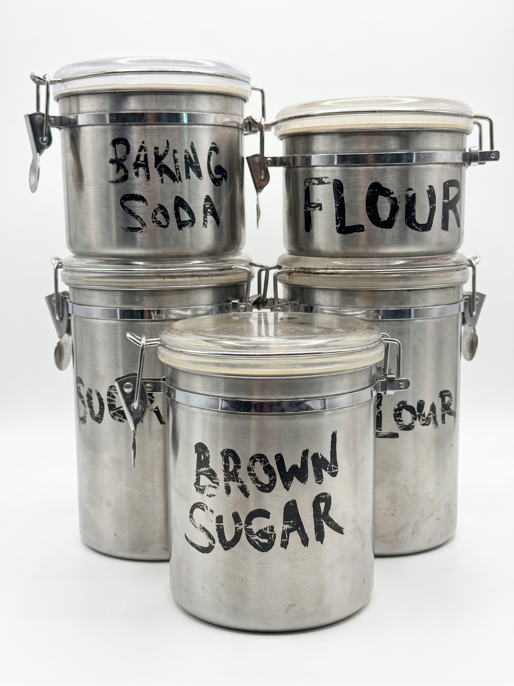 Five Oggi stainless steel tins used to create the Tin Toms percussion samples